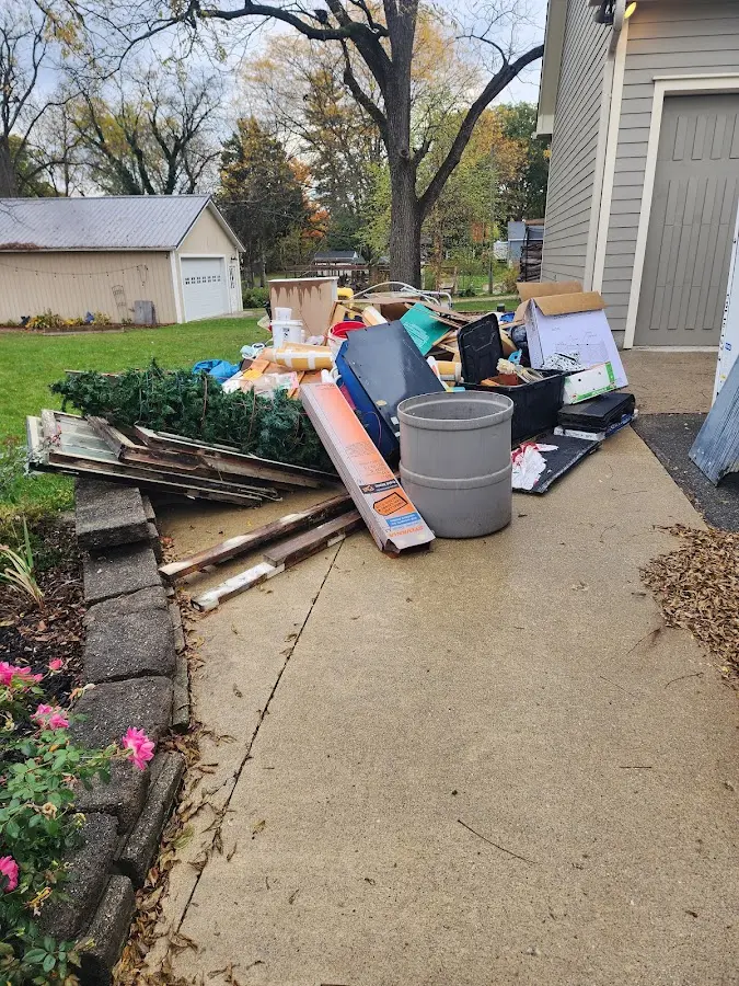 Dumpster being loaded with debris for Residential Dumpster Rental in South Hadley